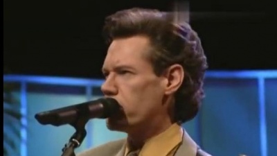 Randy Travis、Bill & Gloria Gaither - Feet On the Rock [Live]